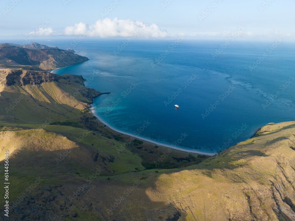Healthy coral reefs fringe the volcanic island of Gili Banta near Komodo, Indonesia. This region is home to extraordinary marine biodiversity and beautiful island scenery. Healthy coral reefs fringe the volcanic island of Gili Banta near Komodo, Indonesia. This region is home to extraordinary marine biodiversity and beautiful island scenery.