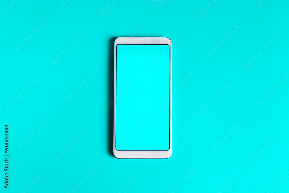 A smartphone with a blue screen close-up on a bright background. A smartphone with a blue screen close-up on a bright background.