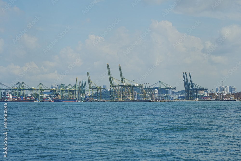 View of modern and busy Singapore Tanjong Pagar PSA ports serving cargo ships in Singapore View of modern and busy Singapore Tanjong Pagar PSA ports serving cargo ships in Singapore