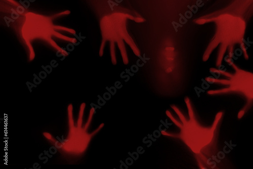 eerie blurry hands of people as if they have been trapped behind glass, dense fabric, wrap, ghost, spirit trying to reach out from afterlifeconcept of violence, nightmares, halloween horror © kittyfly