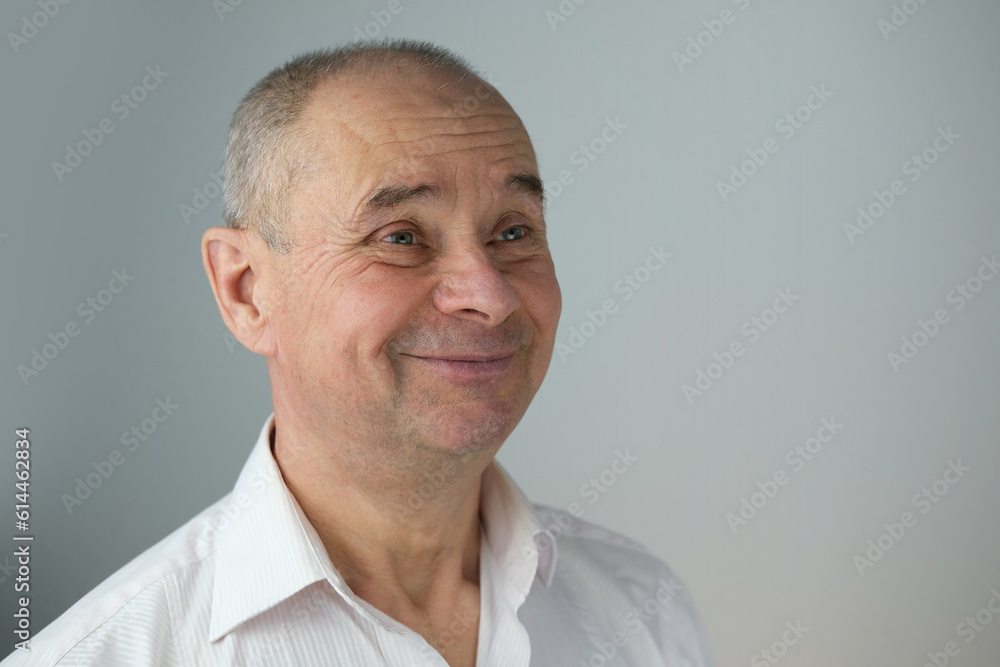 close-up of mature charismatic man, senior 60 years laughs merrily, smiles openly, rejoices at good news, wrinkles on face, overhang, concept human health, good mood, optimism close-up of mature charismatic man, senior 60 years laughs merrily, smiles openly, rejoices at good news, wrinkles on face, overhang, concept human health, good mood, optimism