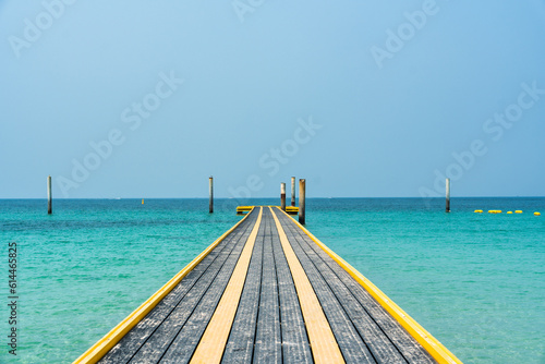 Pontoon walkway floating with pillar on tropical sea