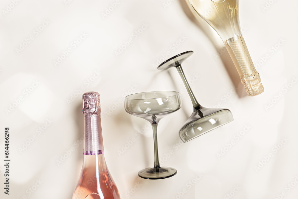 Summer sparkling rose and white wine, top view bottle wine and colored wineglasses, summer alcohol drink background, romance holiday, birthday or wedding drink flat lay. Light effect photo, view Summer sparkling rose and white wine, top view bottle wine and colored wineglasses, summer alcohol drink background, romance holiday, birthday or wedding drink flat lay. Light effect photo, view