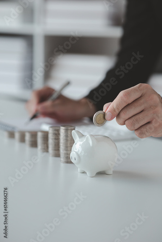 Person with pile of coins and piggy bank, money saving concept for future use and financial stability, salary management, personal finance, investment savings.