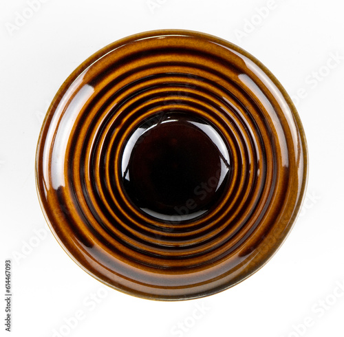 Black ceramic bowl isolated on white background.