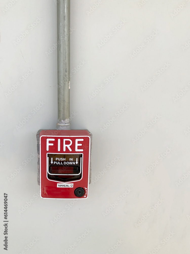 A conventional fire alarm pull station installation work on the white