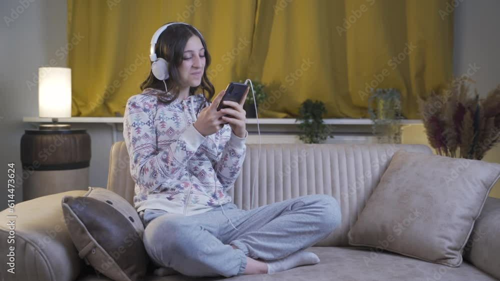 Young woman texting on the phone with happy expression. Young woman texting on the phone with happy expression.