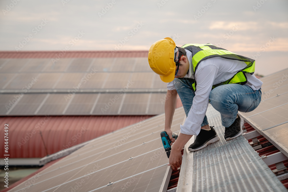 Service engineer checking solar cell on the roof for maintenance if there is a damaged part. Engineer worker install solar panel. Clean energy concept. Service engineer checking solar cell on the roof for maintenance if there is a damaged part. Engineer worker install solar panel. Clean energy concept.