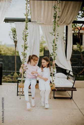 Cute little girls on the sw...