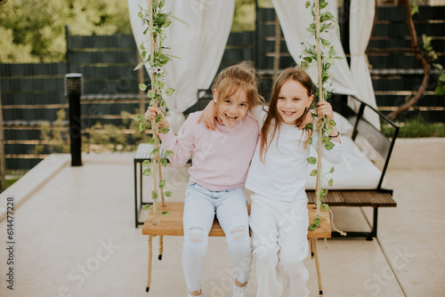 Cute little girls on the sw...