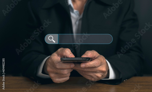 Fototapeta Naklejka Na Ścianę i Meble -  Man hand is using smartphone to search the internet ,data Search Technology Search Engine Optimization to find information virtual screening concept with blank search bar.