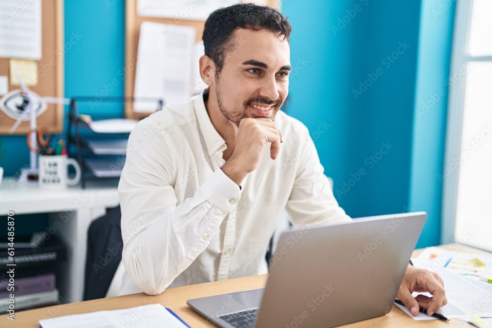Young hispanic man business worker using laptop working at office Young hispanic man business worker using laptop working at office