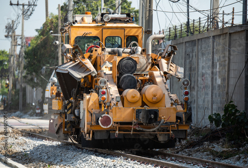 Maintenance railway on working a track tamping machine works on the tracks