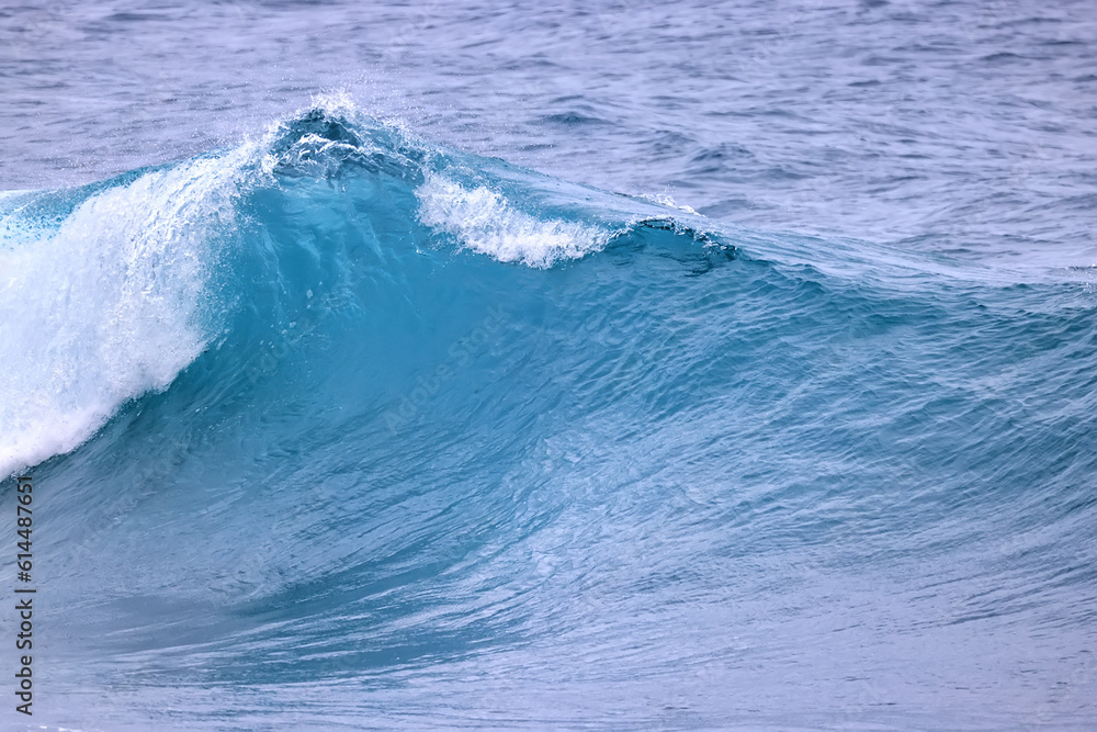Obraz premium wave in the ocean abstract background, blue sea texture motion