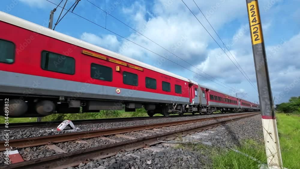 Passenger Train hauled by a WAP7 loco heads towards Pune, at Uruli near Pune India. Passenger Train hauled by a WAP7 loco heads towards Pune, at Uruli near Pune India.