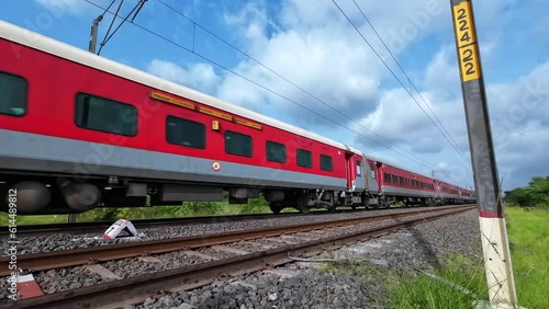 Passenger Train hauled by a WAP7 loco heads towards Pune, at Uruli near Pune India.