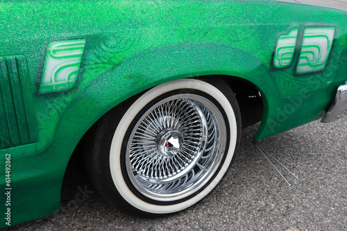 The front wheel from a green 1978 Ford Thunderbird. 