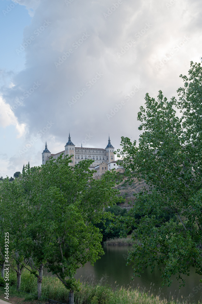 View of the Alcazar of Toledo between trees