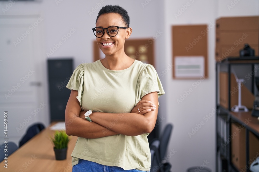 Fototapeta premium African american woman business worker smiling confident standing with arms crossed gesture at office