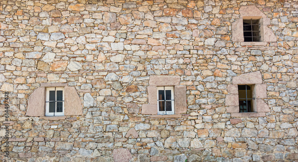 Fototapeta premium Antique of stone wall and window slot from the ancient city