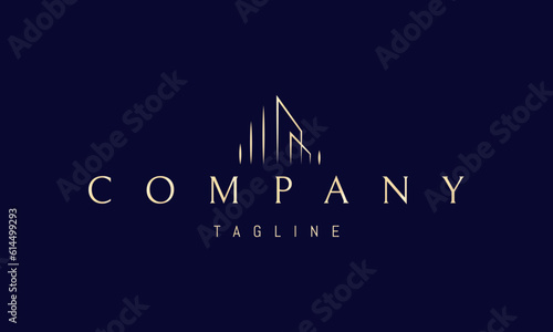 Vector golden logo on which an abstract image of the silhouette of modern skyscrapers in a linear style.