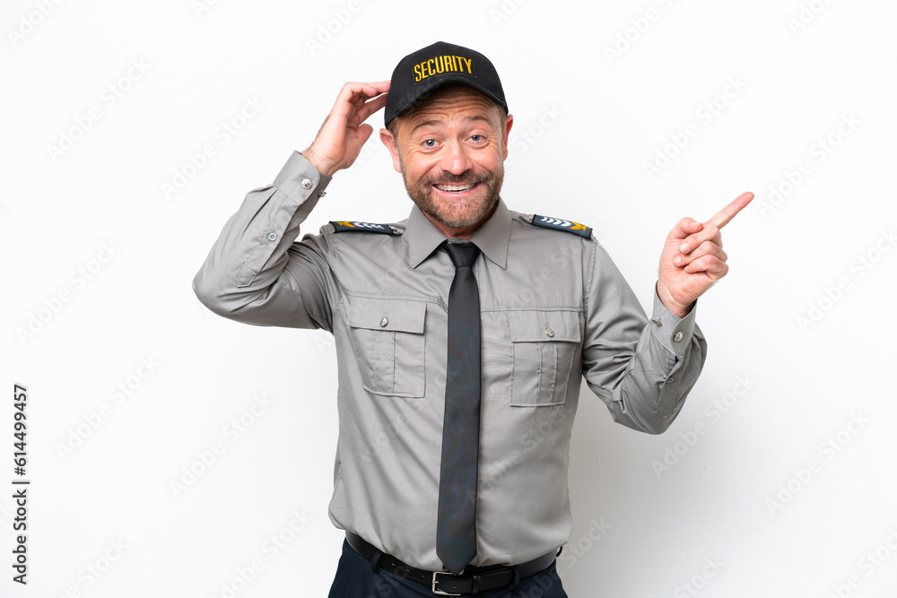 Middle age security man isolated on white background surprised and pointing finger to the side Middle age security man isolated on white background surprised and pointing finger to the side
