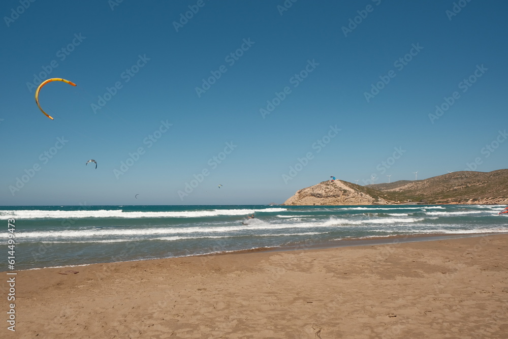 Different Kitesurfing boarders surfing in the sea at the Prasonisi Beach at Rhodes Island.