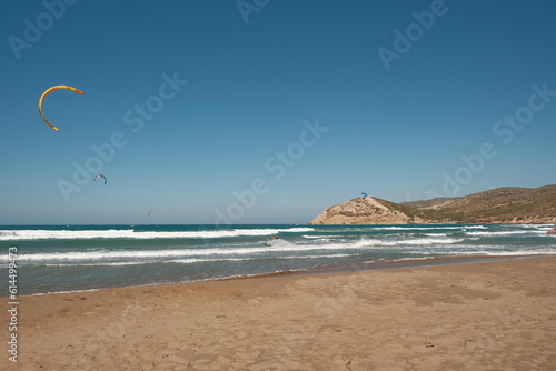 Different Kitesurfing boarders surfing in the sea at the Prasonisi Beach at Rhodes Island.