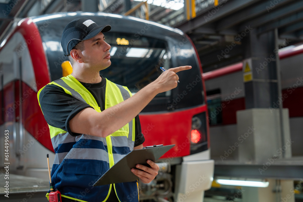 Fototapeta premium Railway technicians check train schedules and perform repairs and maintenance of trains in the depot.