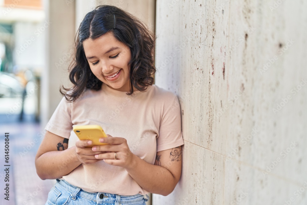 Young woman smiling confident using smartphone at street Young woman smiling confident using smartphone at street