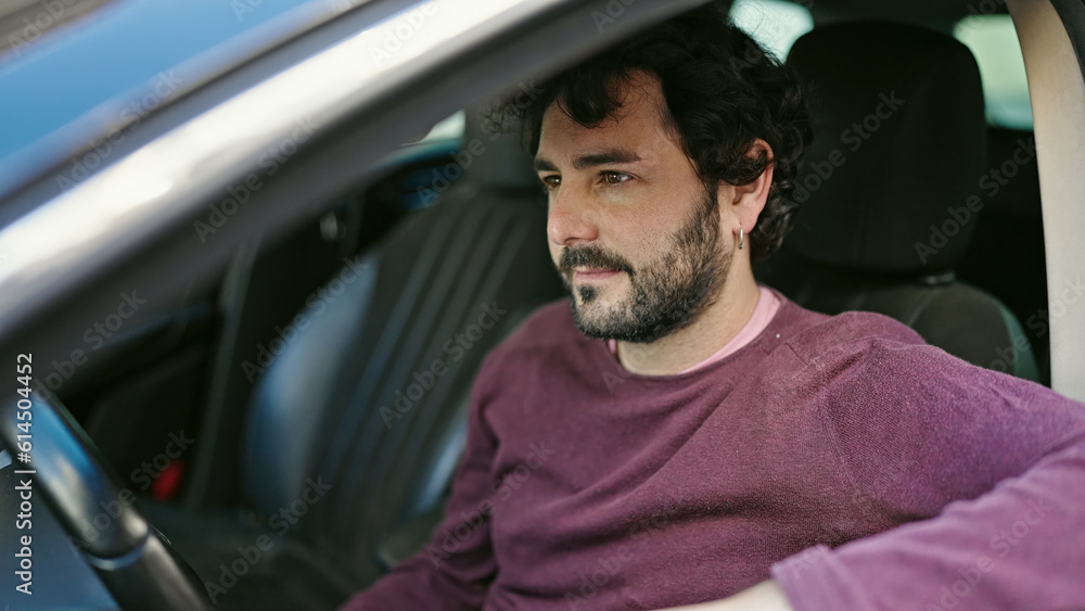 Young hispanic man driving car at street Young hispanic man driving car at street