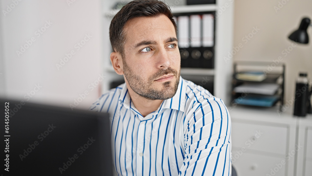 Young hispanic man business worker using computer working at office Young hispanic man business worker using computer working at office