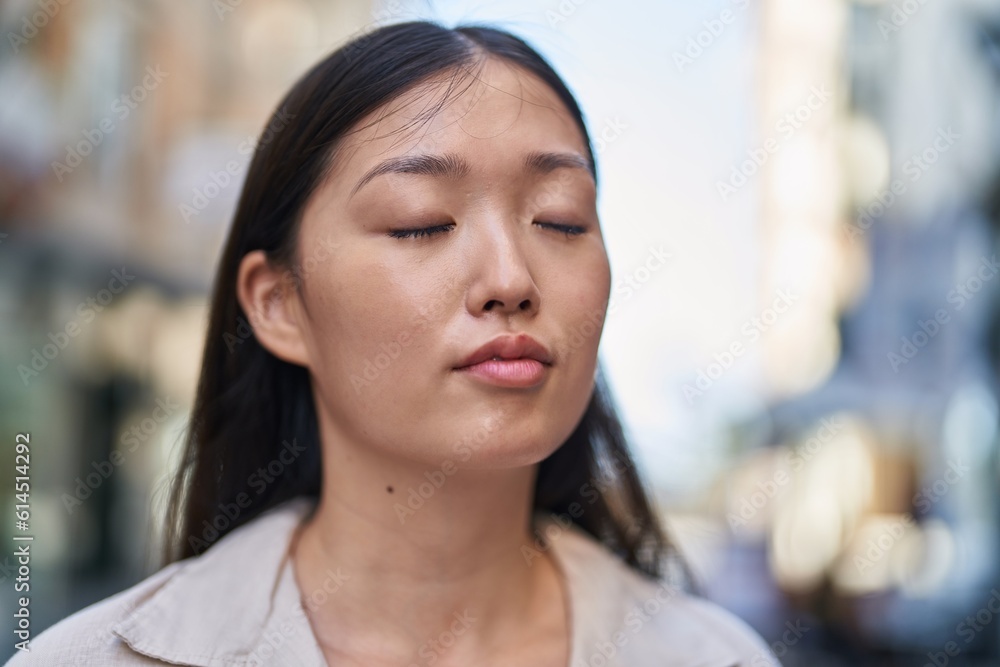 Chinese woman breathing at street Chinese woman breathing at street