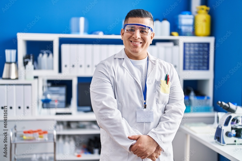 Young latin man scientist smiling confident standing at laboratory Young latin man scientist smiling confident standing at laboratory