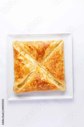 Traditional cheese pie. Khachapuri. On a white background. photo