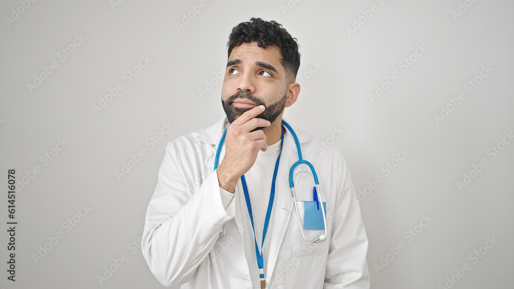 Young hispanic man doctor standing with doubt expression thinking over isolated white background Young hispanic man doctor standing with doubt expression thinking over isolated white background