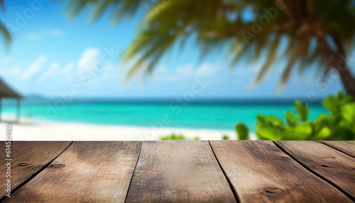 Empty wooden table with tropical beach theme in background © Piotr Krzeslak