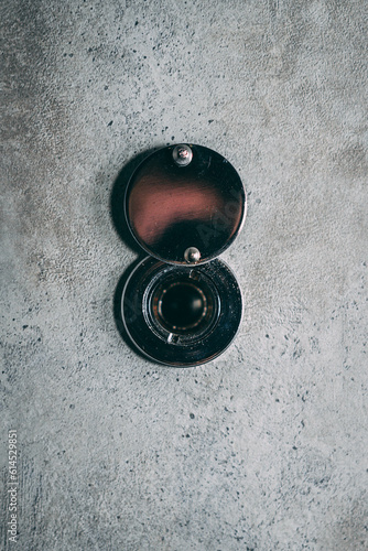The peephole on the gray door