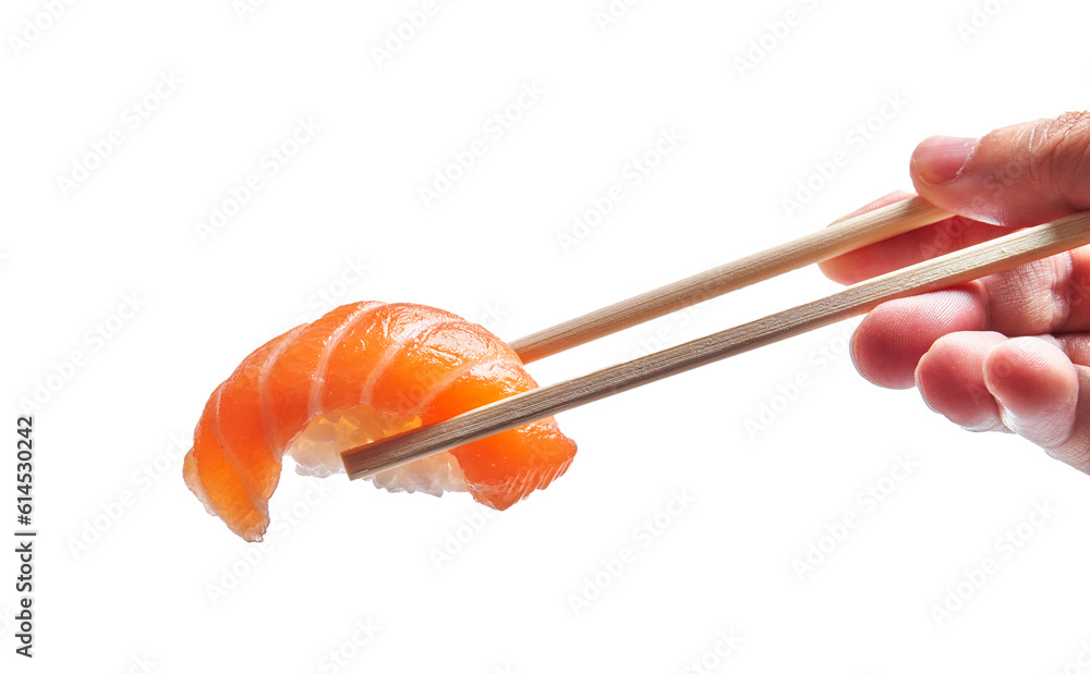 Hand of man holding salmon nigiri with chopsticks over isolated white background Hand of man holding salmon nigiri with chopsticks over isolated white background