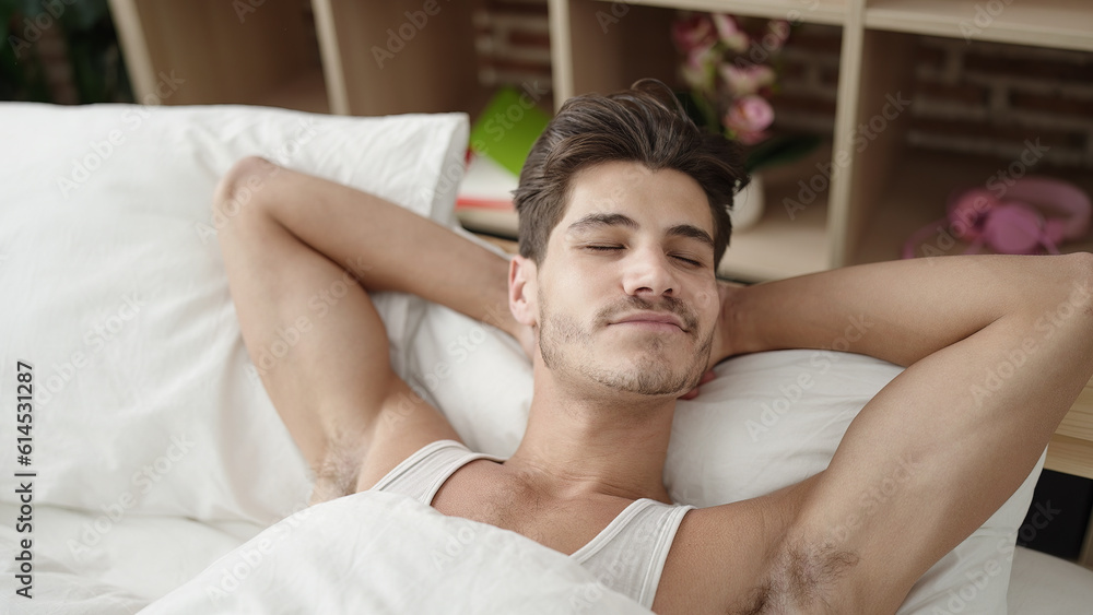 Young hispanic man lying on bed sleeping at bedroom Young hispanic man lying on bed sleeping at bedroom