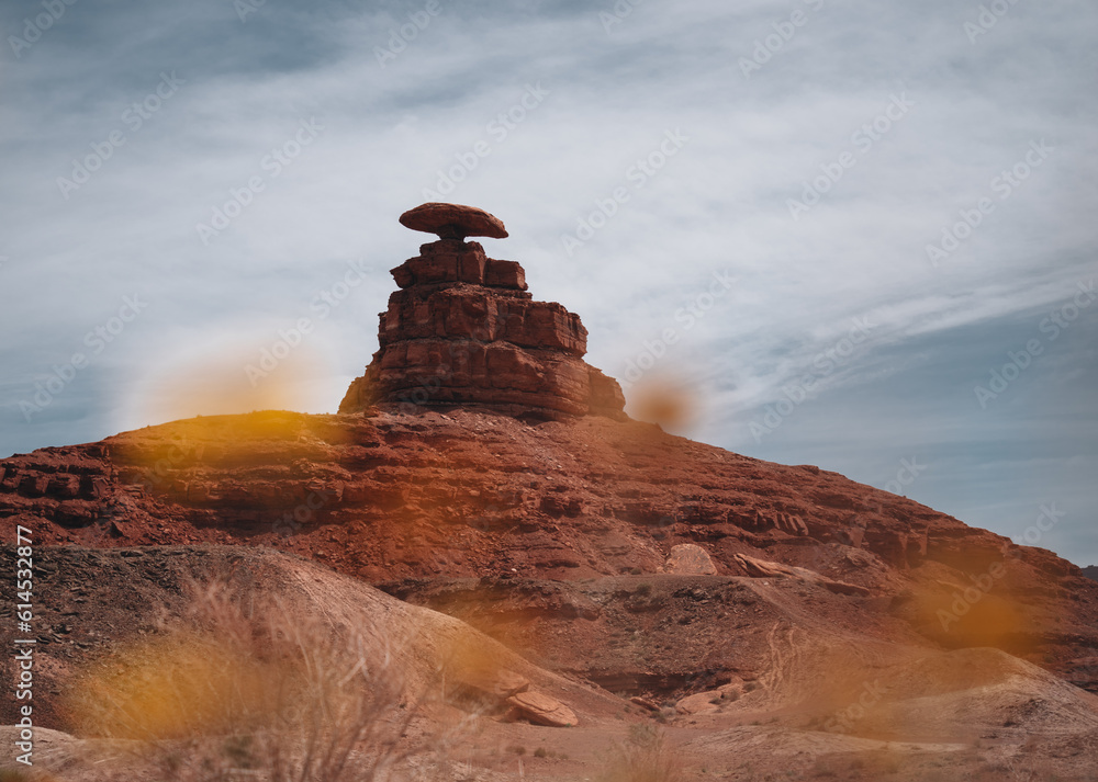 Famous rock Mexican Hat near village of Mexican Hat near Monument Valley, Utah, USA at sunset