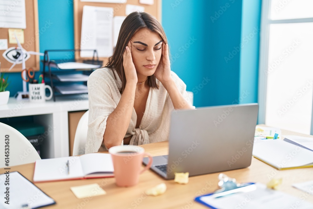 Young beautiful hispanic woman business worker stressed using laptop at office Young beautiful hispanic woman business worker stressed using laptop at office