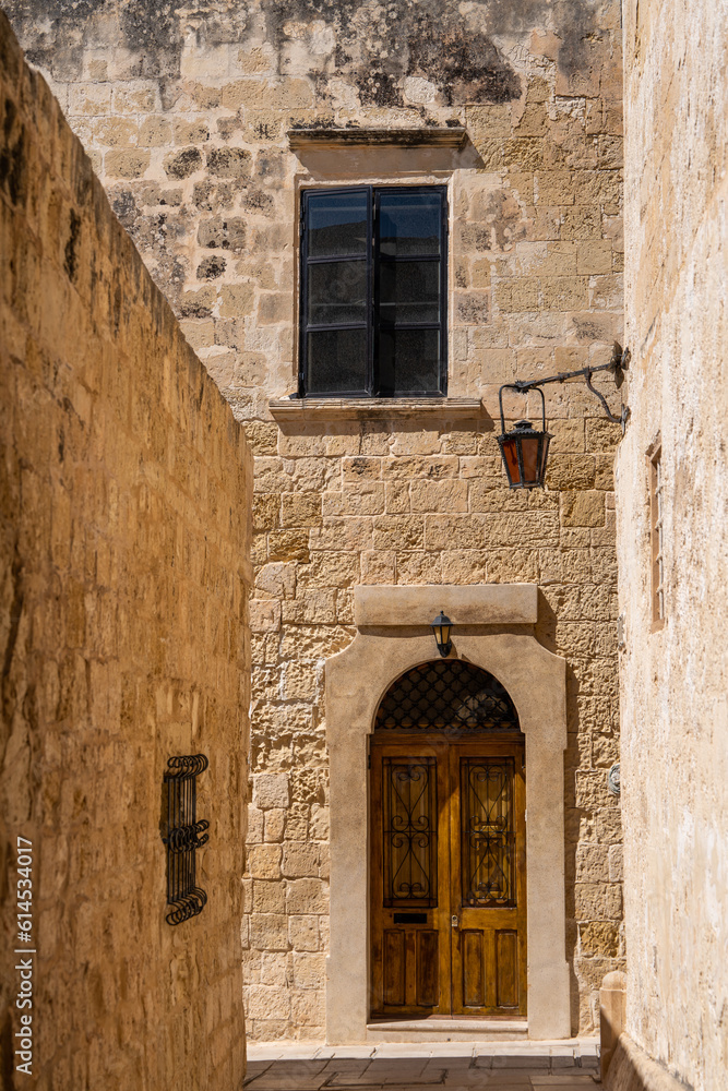 Malta Island, small alley with  typical house in  Mdina