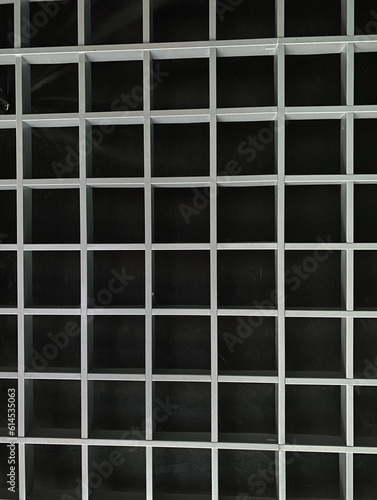 Slatted ceiling, gray on a black background