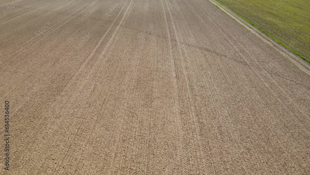 Drone shot of plowed farmland with soil in spring Drone shot of plowed farmland with soil in spring