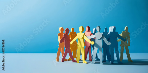 A group of paper people coming together. Community and friendship concept