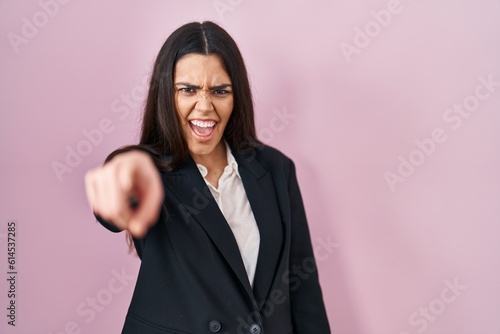 Young brunette woman wearing business style over pink background pointing displeased and frustrated to the camera  angry and furious with you
