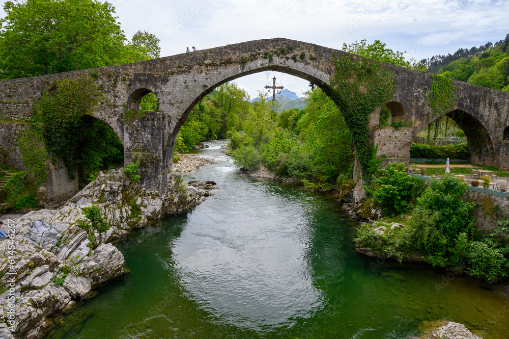 Fototapeta premium Cangas de Onis, mountain village with old roman ruins and bridge, Picos de Europa mountains, Asturias, North of Spain