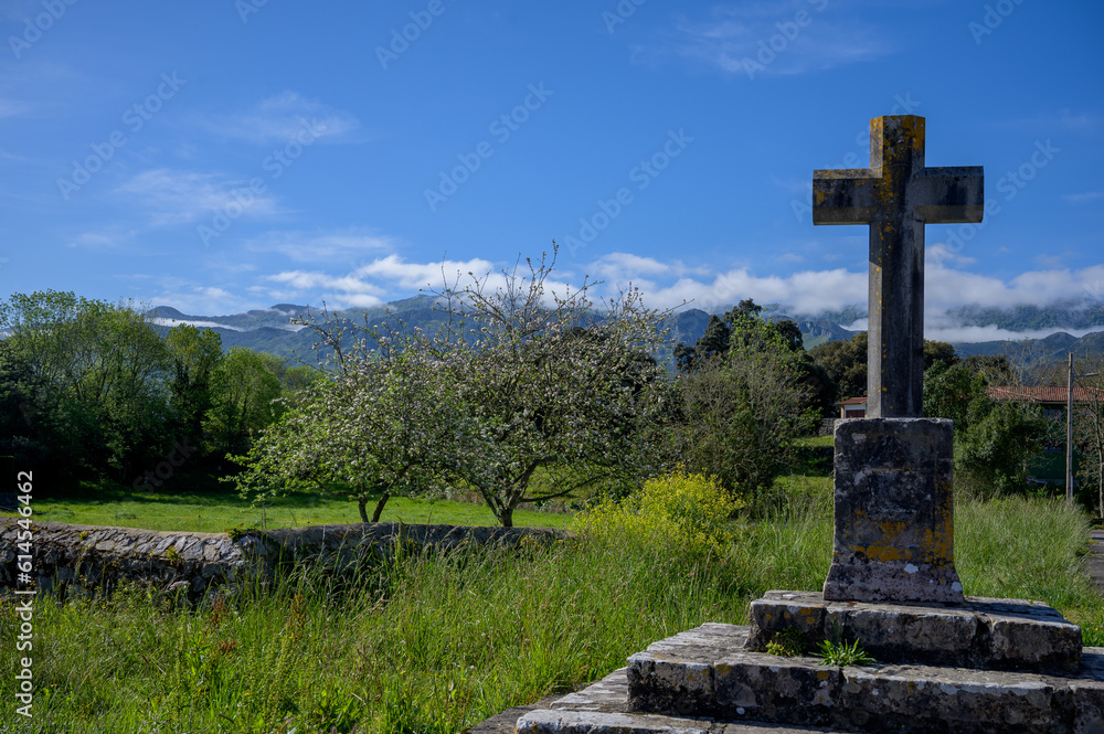 Pilgrims route cross, Vacation on Green coast of Asturias, Celorio village with sandy beaches, North of Spain