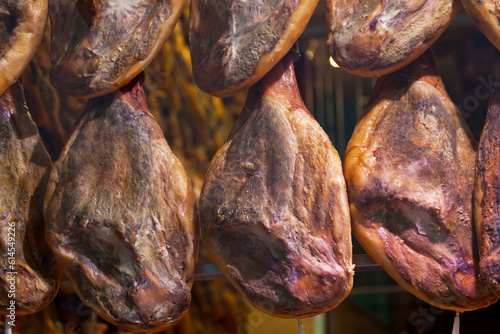 Hams in the window of a delicatessen photo